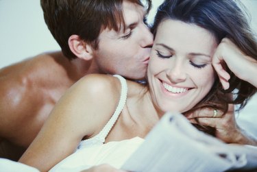 Close-up of a young man kissing a young woman