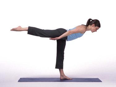 Caucasian Woman Posing On A Blue Yoga Mat