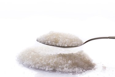 granulated sugar in a spoon