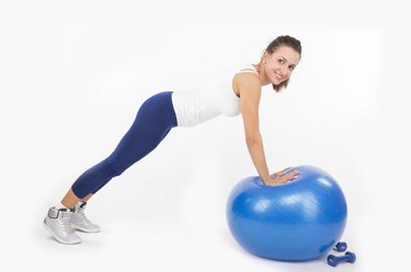 Woman doing a plank on an exercise ball. Please view all pictures of this model plus other fitness & exercise images in my portfolio.