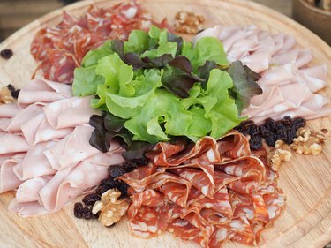 Mixed Sliced Meat on the wooden Board