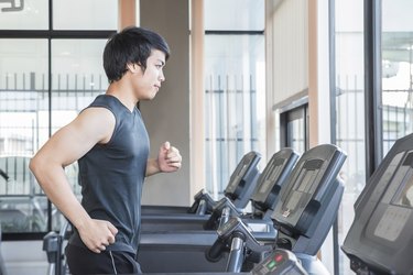 man at the gym doing exercise on  treadmill