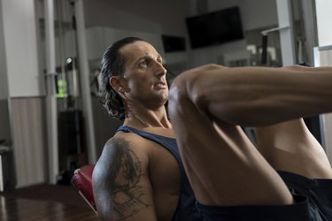 Man in gym on machine exercising