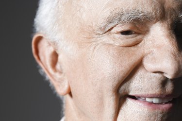 Senior man in studio, close up