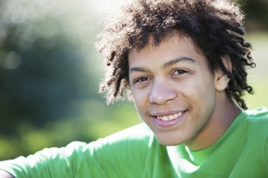 Real People: Mixed Race Teenage Boy in Sunlight Closeup Headshot