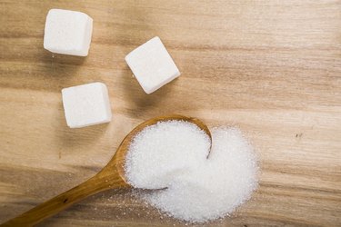 Sugar in a wooden spoon