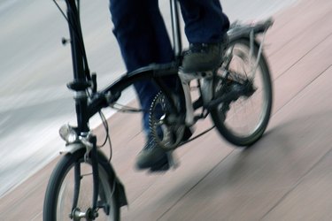 Person riding folding bicycle.