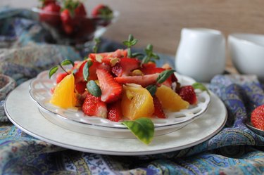 fruit salad with strawberries, oranges, pistachios