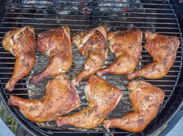 Chicken legs on a charcoal grill