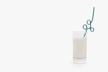 Glass of milk with a crazy straw