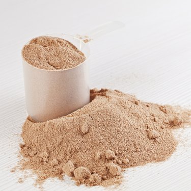 Scoop of chocolate whey isolate protein powder