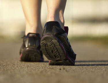 Sports female in black running shoes