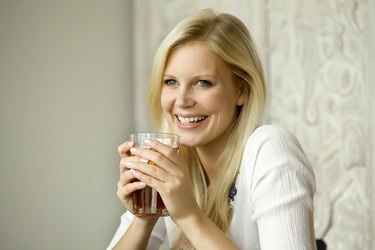 Young woman with tea glass