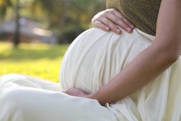 Pregnant woman in a garden