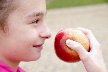 people, children, healthy eating and food concept- happy girl ho