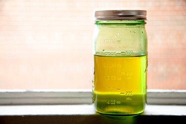 Organic oil jar on windowsill
