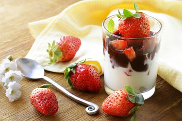 dairy dessert with chocolate sauce and strawberries