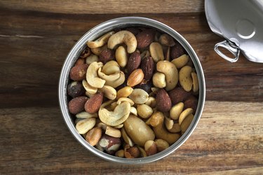 Can of healthy nuts over a cutting table