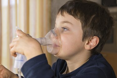 child with inhaler mask