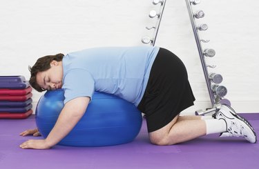 Overweight Man sleeping On Exercise Ball