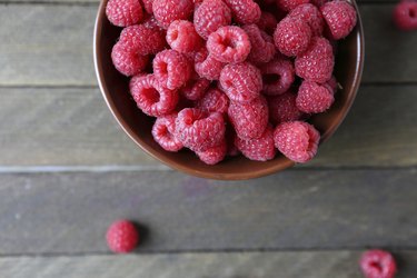 fresh raspberries in a ceramic bowl