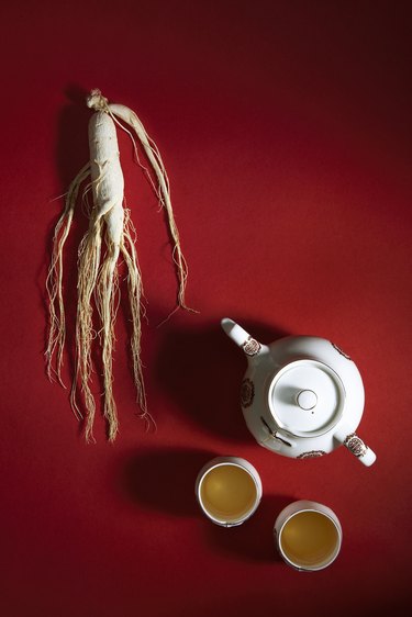 Ginseng root and tea pot with cups