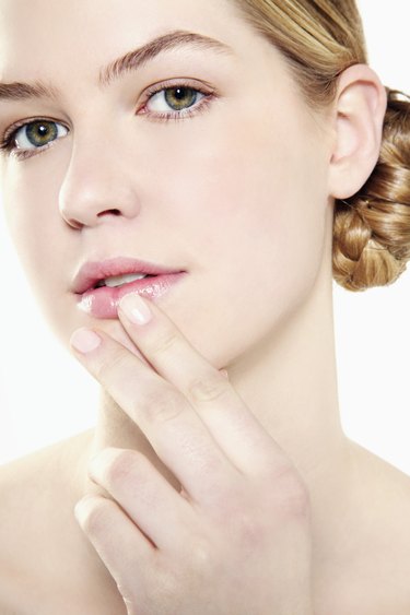 Portrait of a Young Woman With Her Finger on Her Lips