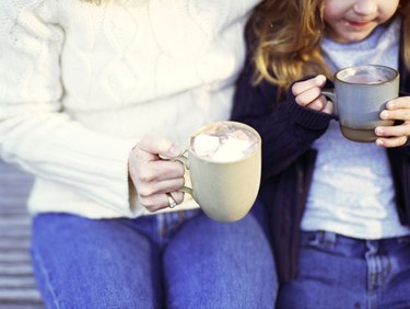 Mother and daughter with hot chocolate