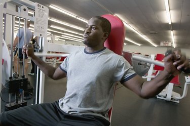 Man using weight machine in gym