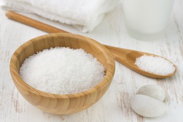 salt with spoon, towel and bottle