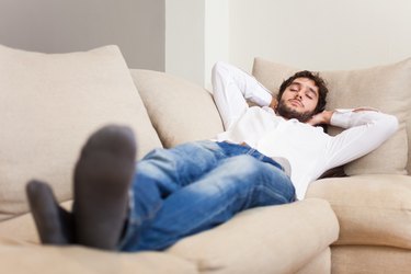Man sleeping on his couch
