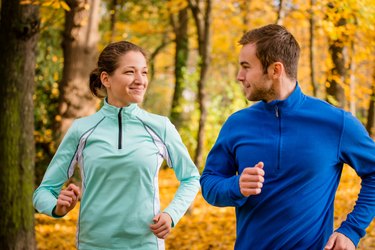 Young people jogging together in nature