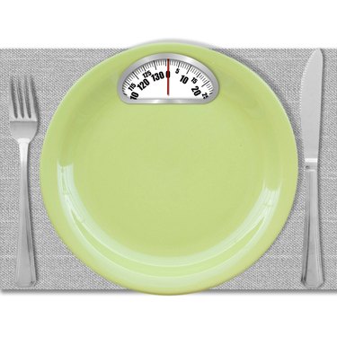 Diet concept. Plate with scales