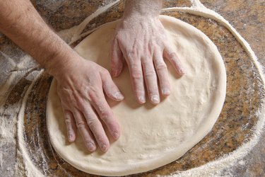 Chef Preparing pizza dough