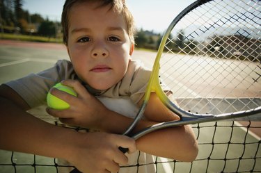 Boy with tennis racket