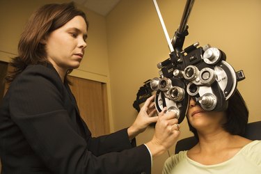 Woman getting eye exam