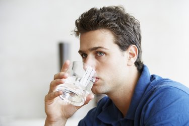 Young Man Drinking Water