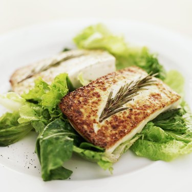 close-up of grilled cheese served on lettuce greens