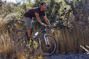 Hispanic man riding mountain bike