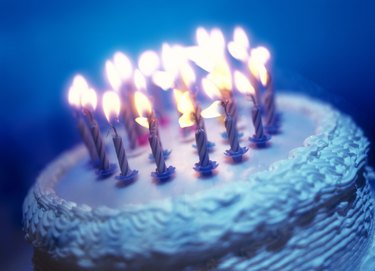 tungsten toned close-up of an array of candles on a birthday cake