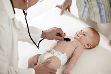 Doctor examining baby