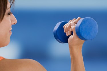 Woman holding dumbbell