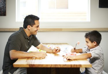 man and boy eating