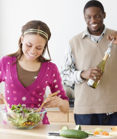 African couple preparing food