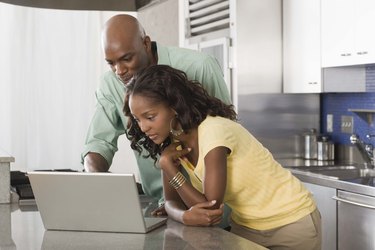 Couple with a laptop computer