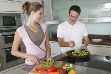 Couple cooking in kitchen