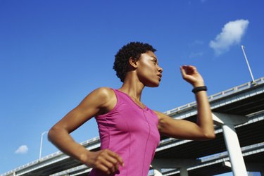 Low angle view of a young woman jogging