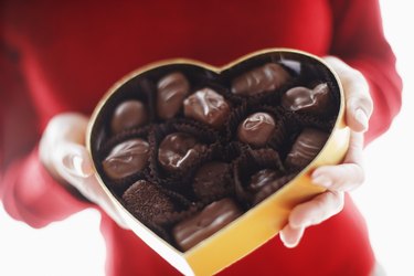 Woman Holding Box of Chocolates