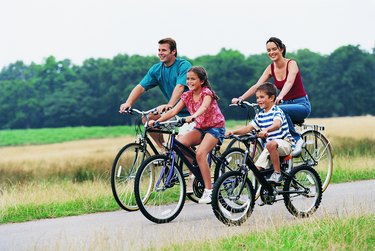 Family Cycling on a Country Road