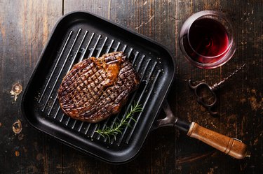 Grilled Steak Ribeye on pan and wine